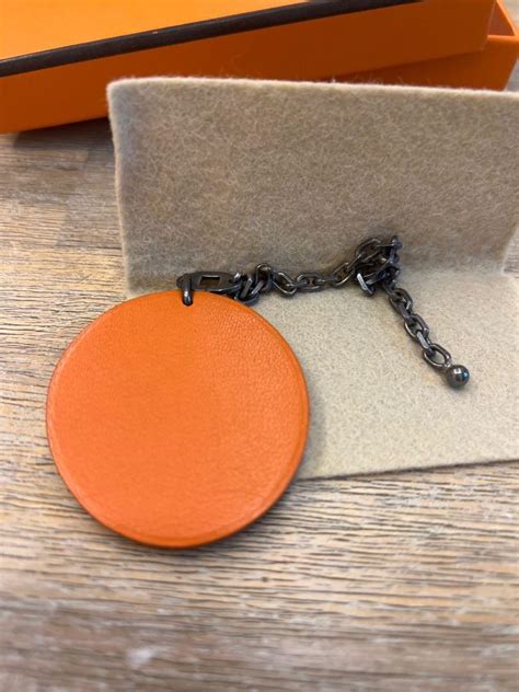 hermes orange charm|Hermes charm necklace.